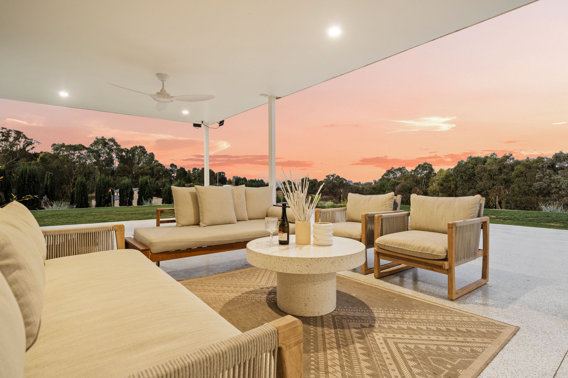 Covered outdoor living area at sunset